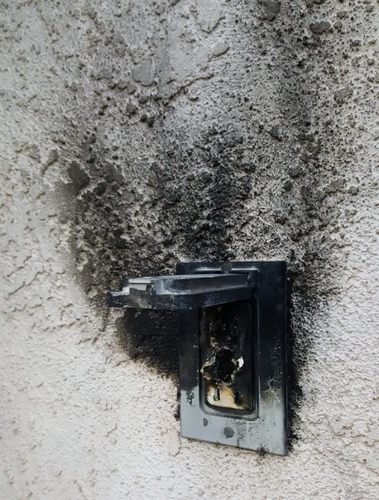 Outlet on fire as a result of poor electrical maintenance in St. Louis, MO