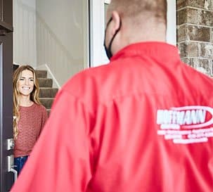 Hoffmann Brothers associate speaking with a home owner.