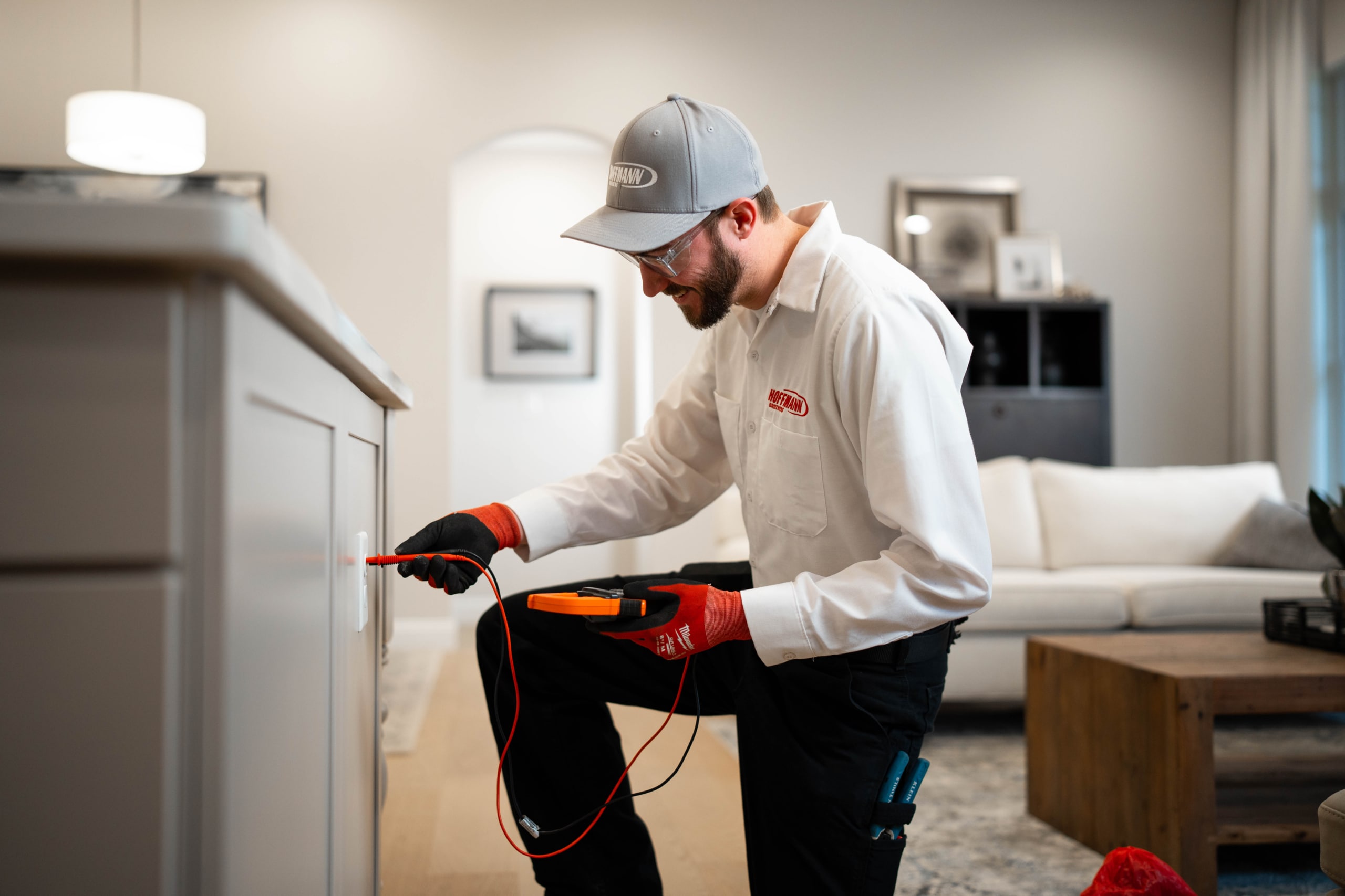 Electrician in Nashville installing an outlet