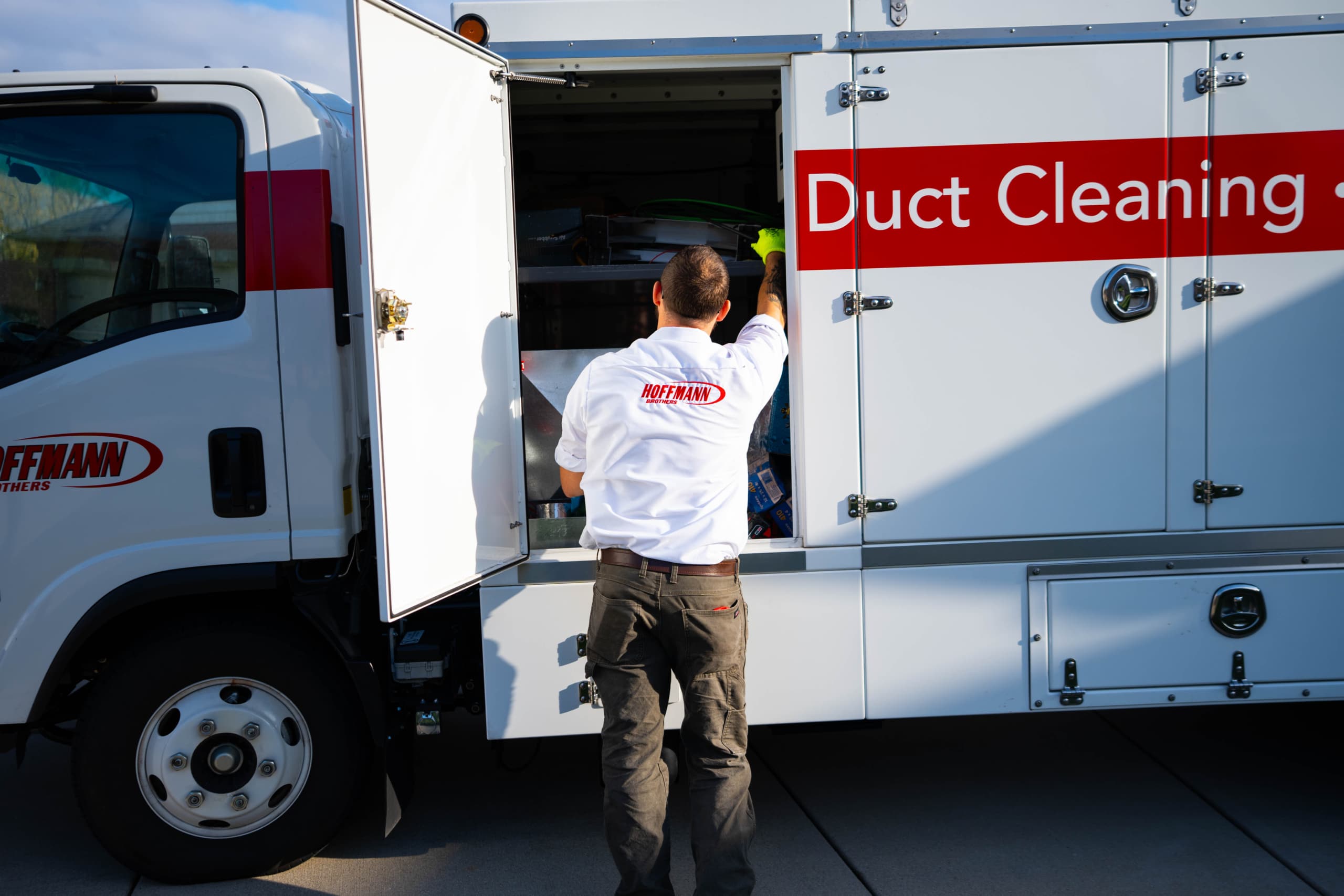 Hoffmann Bros duct cleaning expert unloading gear from truck before duct cleaning in St Louis