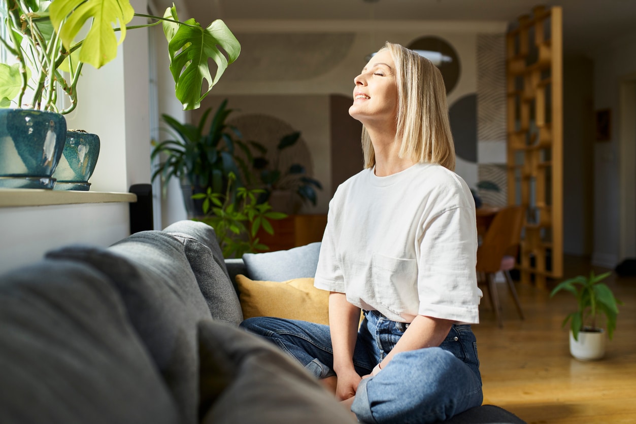 Person enjoying Fresh Indoor Air After A Home Indoor Air Quality Test Shows Their Air is Clean From An IAQ System